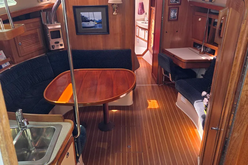  Yacht Photos Pics Interior of 2007 Catalina 42 MkII sailboat with wood finish and seating area.