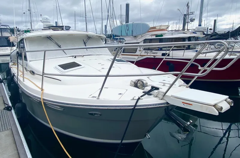 Sea Dreamer Yacht Photos Pics 2014 Cutwater 30 Sedan boat docked in marina, surrounded by other vessels.