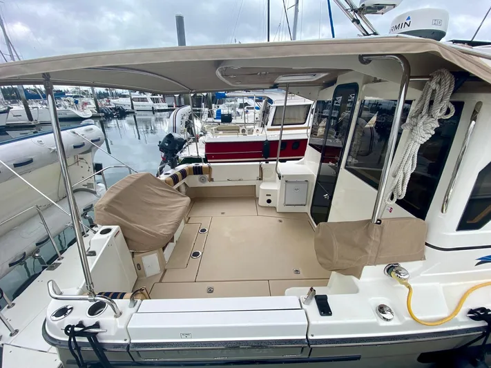 Sea Dreamer Yacht Photos Pics 2014 Cutwater 30 Sedan boat with spacious deck, docked at marina.
