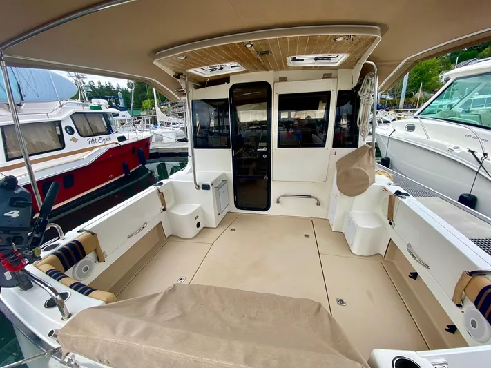 Sea Dreamer Yacht Photos Pics 2014 Cutwater 30 Sedan boat interior with spacious deck and seating area.