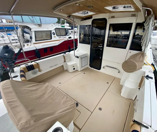 Sea Dreamer Yacht Photos Pics 2014 Cutwater 30 Sedan boat interior with covered seating and spacious deck area.