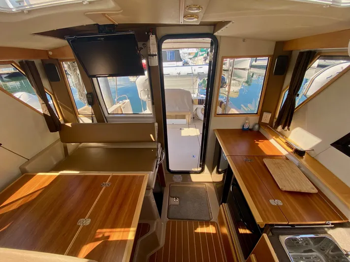 Sea Dreamer Yacht Photos Pics Interior of 2014 Cutwater 30 Sedan boat with wood finish and modern amenities.