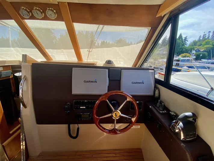 Sea Dreamer Yacht Photos Pics Interior helm of 2014 Cutwater 30 Sedan with Garmin navigation systems.
