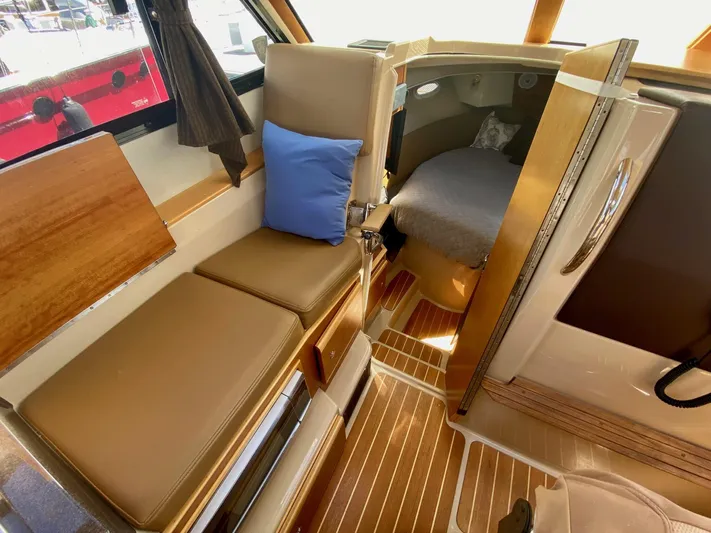 Sea Dreamer Yacht Photos Pics Interior of 2014 Cutwater 30 Sedan boat with seating and cabin area.