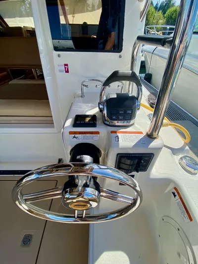 Sea Dreamer Yacht Photos Pics Steering wheel and controls of a 2014 Cutwater 30 Sedan boat.