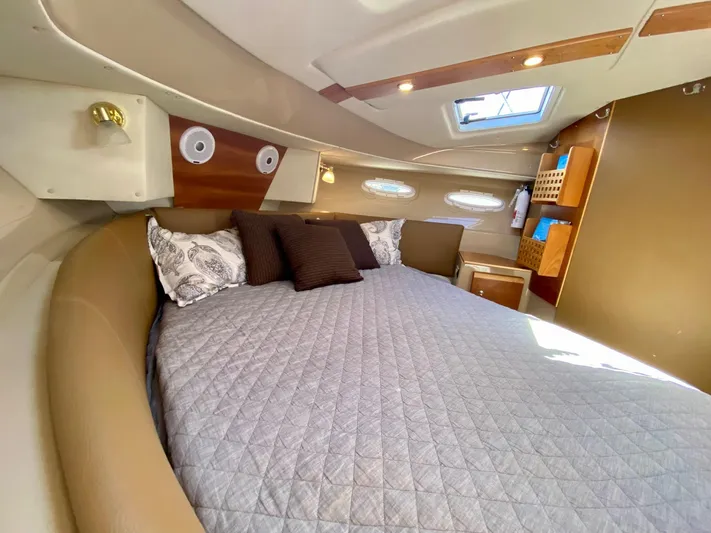 Sea Dreamer Yacht Photos Pics Interior of 2014 Cutwater 30 Sedan boat with cozy bed and elegant decor.