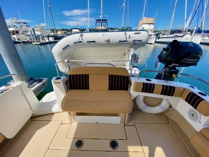 Sea Dreamer Yacht Photos Pics 2014 Cutwater 30 Sedan boat interior with seating, docked at marina.