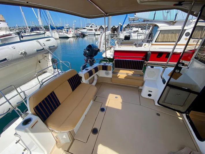 Sea Dreamer Yacht Photos Pics 2014 Cutwater 30 Sedan boat interior with seating, docked at marina.