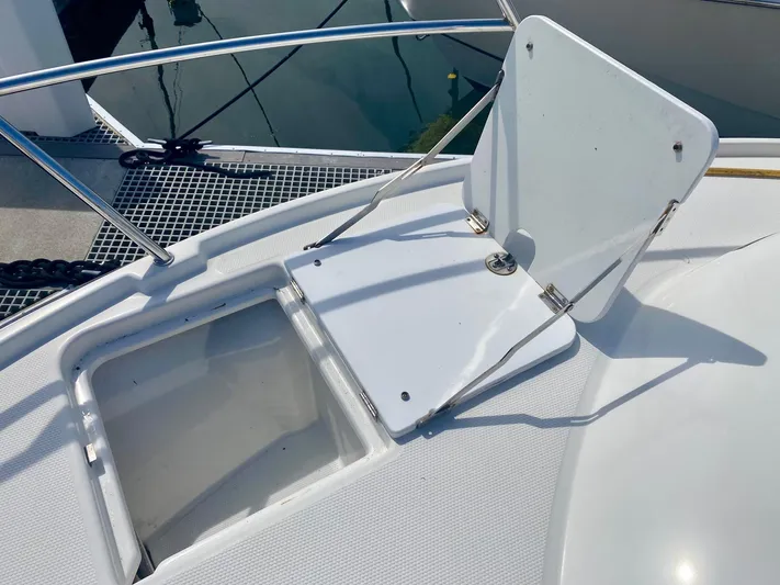 Sea Dreamer Yacht Photos Pics Open hatch on 2014 Cutwater 30 Sedan boat deck, showing storage compartment.