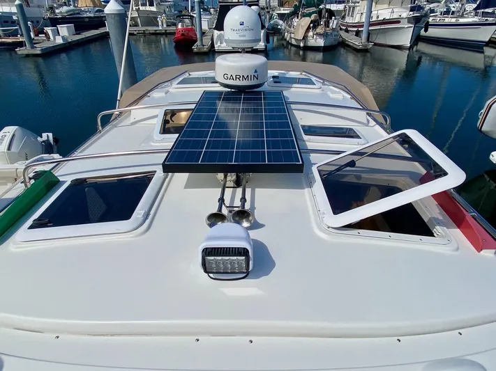 Sea Dreamer Yacht Photos Pics 2014 Cutwater 30 Sedan with solar panel and Garmin equipment at marina.