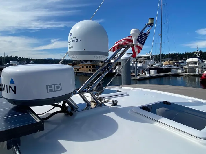 Sea Dreamer Yacht Photos Pics 2014 Cutwater 30 Sedan with radar equipment and American flag at marina.