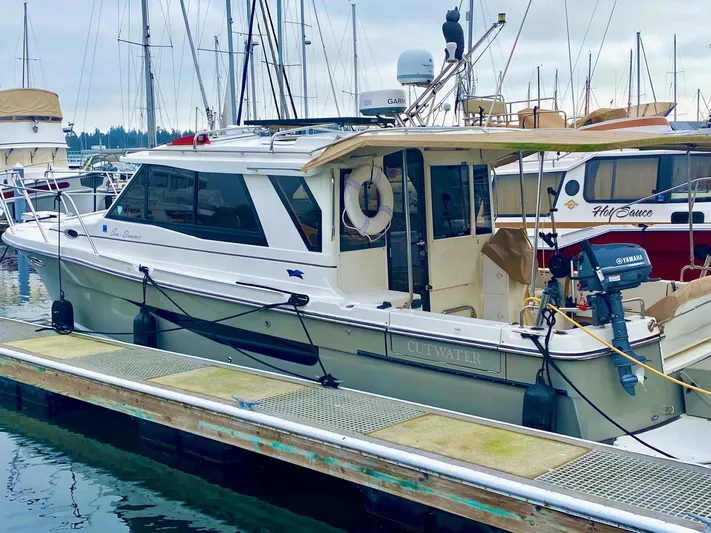 Sea Dreamer Yacht Photos Pics 2014 Cutwater 30 Sedan boat docked at marina with other vessels.