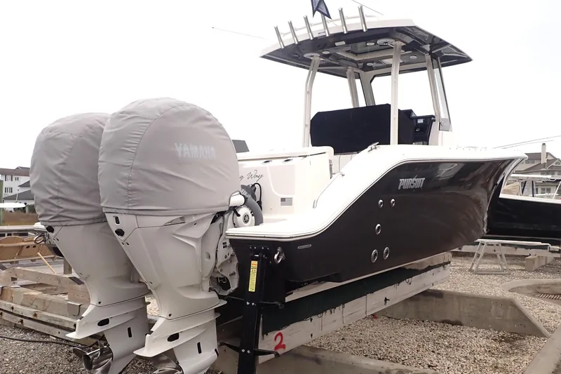  Yacht Photos Pics 2024 Pursuit S 288 Sport boat with twin Yamaha engines, docked on a trailer.