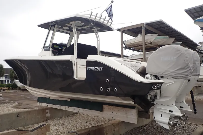  Yacht Photos Pics 2024 Pursuit S 288 Sport boat with Yamaha engines on a dry dock.