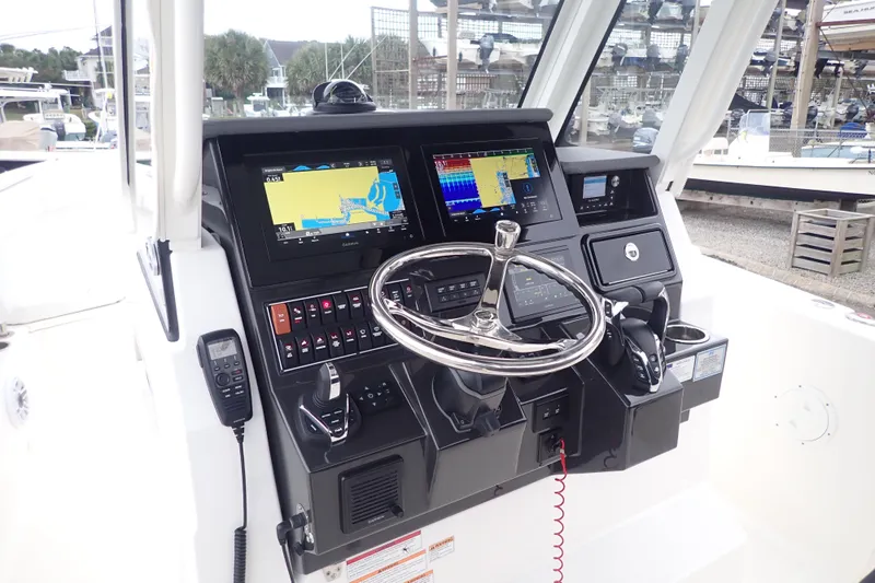  Yacht Photos Pics 2024 Pursuit S 288 Sport boat dashboard with advanced navigation and control systems.