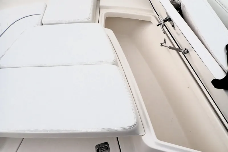  Yacht Photos Pics 2024 Pursuit S 288 Sport boat interior storage compartment with cushioned seating.