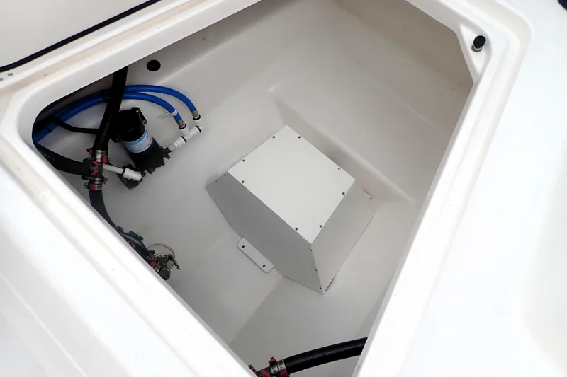  Yacht Photos Pics 2024 Pursuit S 288 Sport boat compartment with plumbing and storage features.