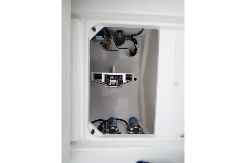  Yacht Photos Pics 2024 Pursuit S 288 Sport boat compartment with mechanical components and wiring.