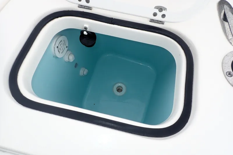  Yacht Photos Pics 2024 Pursuit S 288 Sport boat livewell with open lid, showcasing interior features.