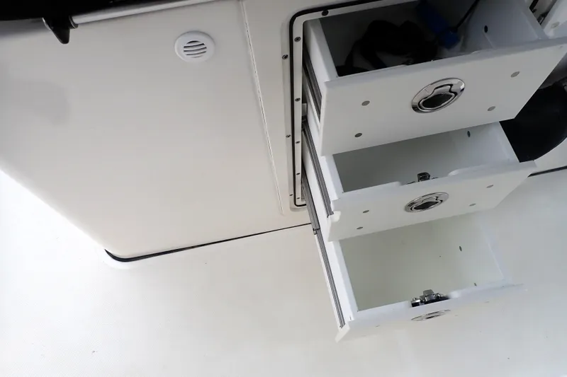  Yacht Photos Pics 2024 Pursuit S 288 Sport boat storage drawers, open and empty.