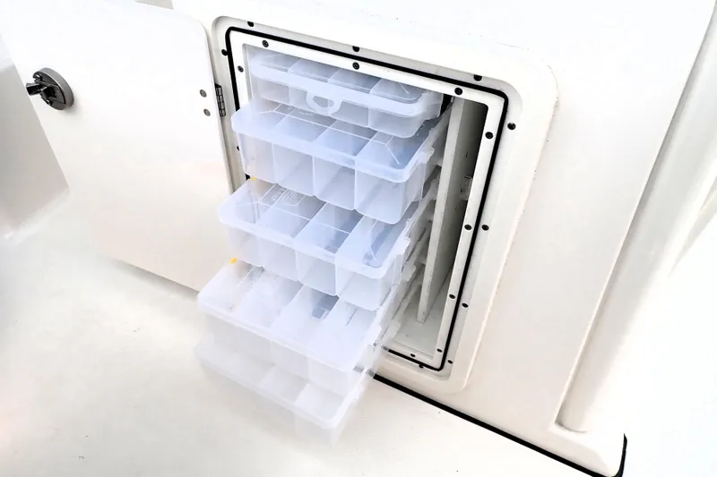  Yacht Photos Pics 2024 Pursuit S 288 Sport boat tackle storage with multiple clear plastic trays.