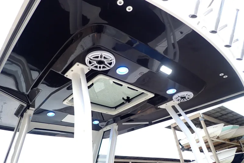  Yacht Photos Pics 2024 Pursuit S 288 Sport boat interior with speakers and lighting on black ceiling.