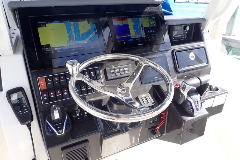  Yacht Photos Pics 2024 Pursuit S 288 Sport boat dashboard with advanced navigation and control systems.