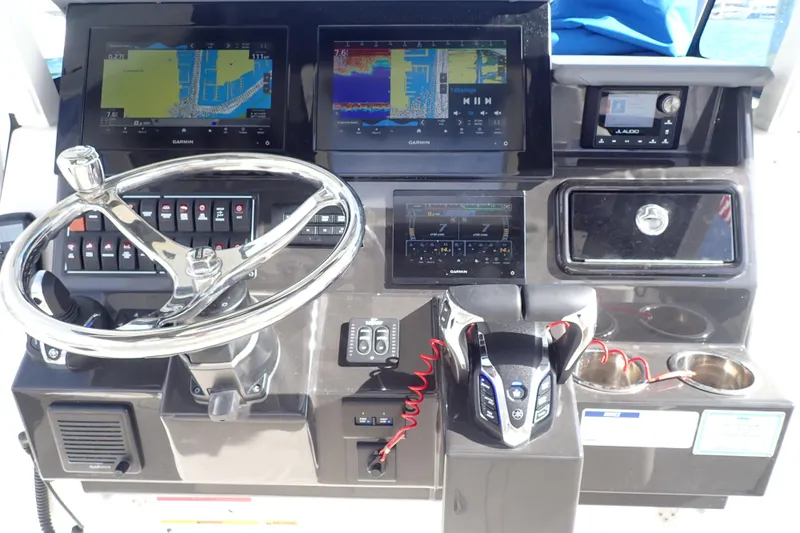  Yacht Photos Pics 2024 Pursuit S 288 Sport boat dashboard with advanced navigation and control systems.