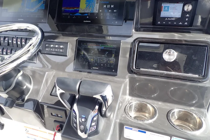  Yacht Photos Pics 2024 Pursuit S 288 Sport dashboard with Garmin displays and JL Audio system.
