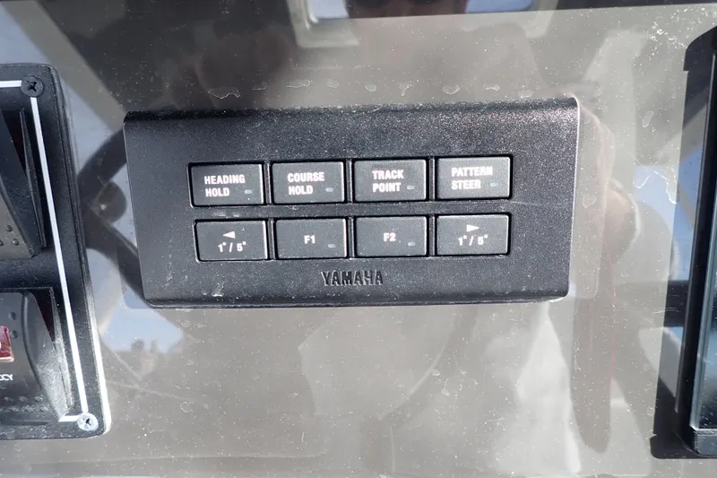 Yacht Photos Pics Control panel of 2024 Pursuit S 288 Sport boat with Yamaha navigation buttons.