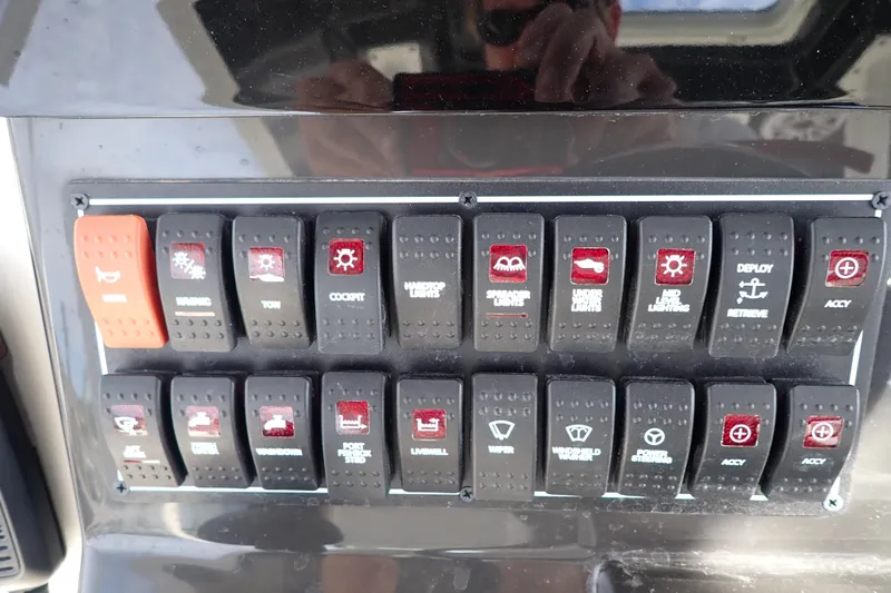  Yacht Photos Pics Control panel of 2024 Pursuit S 288 Sport boat with labeled switches.
