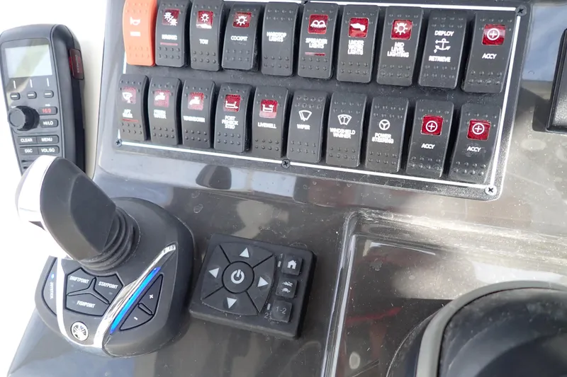  Yacht Photos Pics Control panel of 2024 Pursuit S 288 Sport boat with switches and joystick.