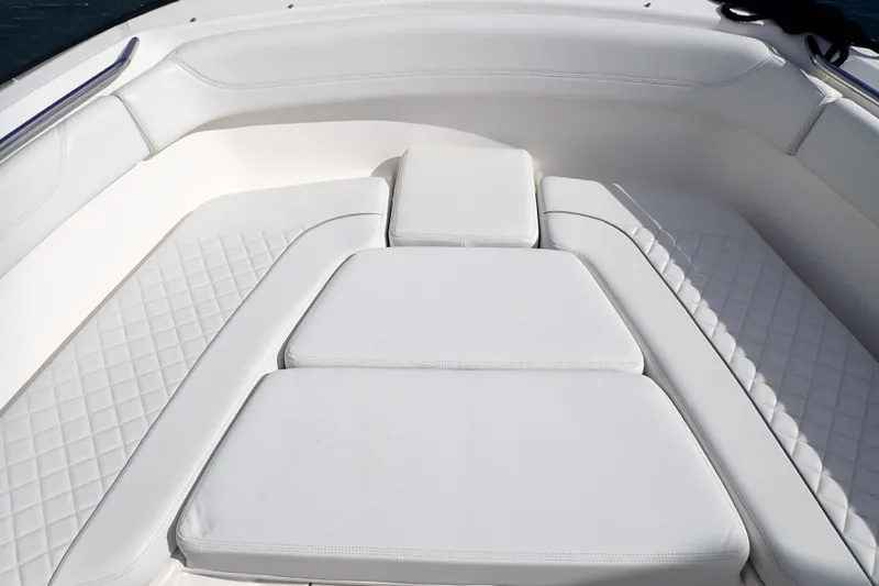  Yacht Photos Pics 2024 Pursuit S 288 Sport boat with luxurious white cushioned seating.