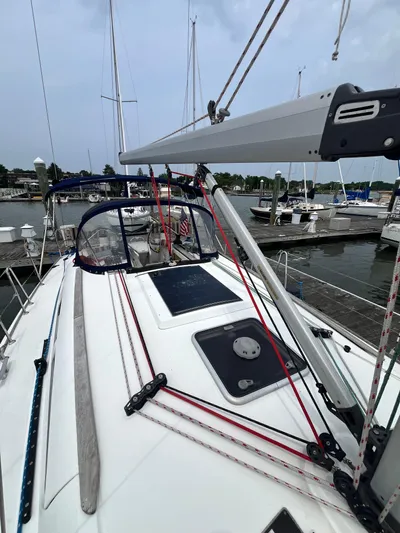 Miss Charlotte Yacht Photos Pics 2007 Jeanneau Sun Odyssey 39i sailboat deck with rigging, docked at marina.