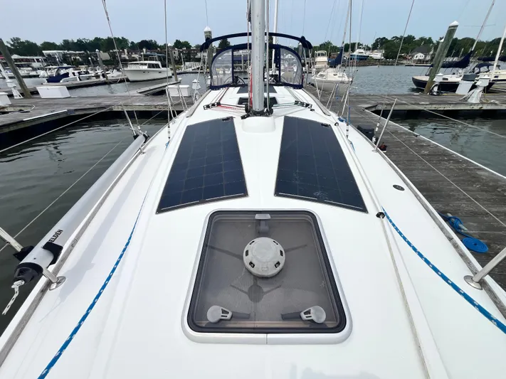 Miss Charlotte Yacht Photos Pics 2007 Jeanneau Sun Odyssey 39i sailboat with solar panels docked at marina.