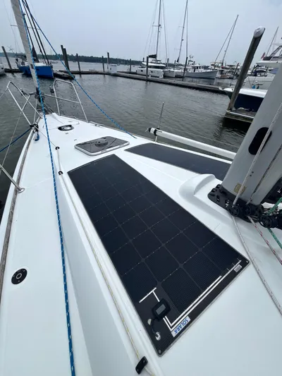 Miss Charlotte Yacht Photos Pics 2007 Jeanneau Sun Odyssey 39i sailboat with solar panels docked at marina.