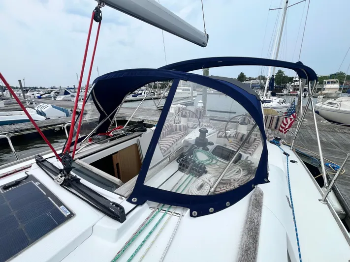 Miss Charlotte Yacht Photos Pics 2007 Jeanneau Sun Odyssey 39i sailboat docked at marina, featuring cockpit and canopy.