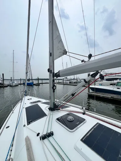 Miss Charlotte Yacht Photos Pics 2007 Jeanneau Sun Odyssey 39i sailboat docked at marina, showcasing deck and rigging.