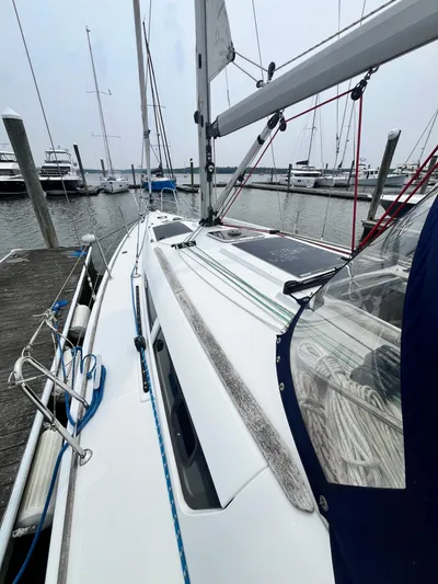 Miss Charlotte Yacht Photos Pics 2007 Jeanneau Sun Odyssey 39i sailboat docked at marina, showcasing deck and rigging.