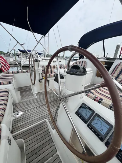 Miss Charlotte Yacht Photos Pics 2007 Jeanneau Sun Odyssey 39i sailboat cockpit with dual steering wheels and navigation instruments.