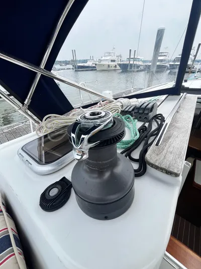 Miss Charlotte Yacht Photos Pics Jeanneau Sun Odyssey 39i sailboat deck with winch and ropes, docked at marina.