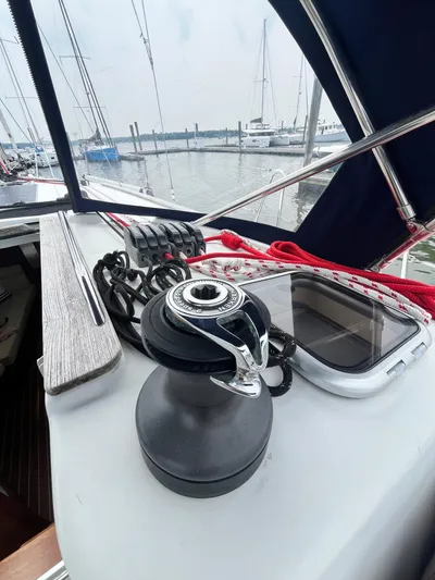 Miss Charlotte Yacht Photos Pics 2007 Jeanneau Sun Odyssey 39i sailboat deck with winch and ropes in marina.