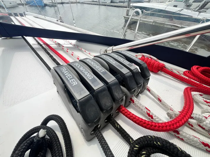 Miss Charlotte Yacht Photos Pics Deck of 2007 Jeanneau Sun Odyssey 39i with labeled rope clutches.