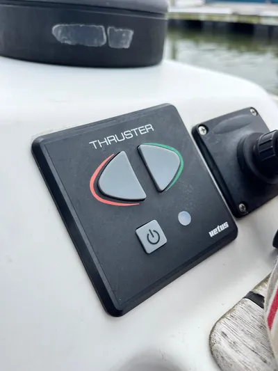 Miss Charlotte Yacht Photos Pics Thruster control panel on a 2007 Jeanneau Sun Odyssey 39i sailboat.