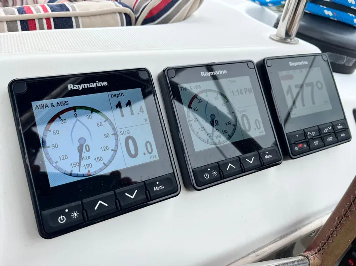 Miss Charlotte Yacht Photos Pics Raymarine instruments on 2007 Jeanneau Sun Odyssey 39i sailboat dashboard, displaying navigation data.
