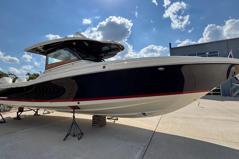  Yacht Photos Pics 2021 Chris-Craft Calypso 35 boat displayed outdoors under a blue sky.