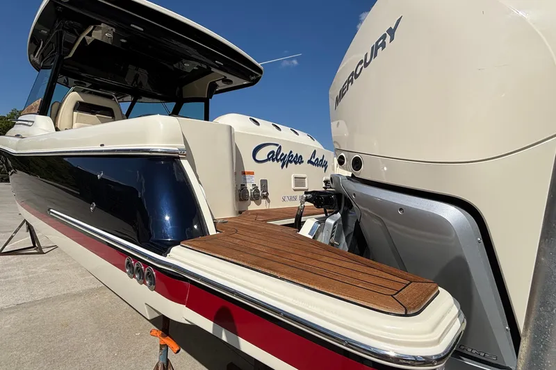  Yacht Photos Pics 2021 Chris-Craft Calypso 35 boat with Mercury engine, featuring sleek design and wooden deck.