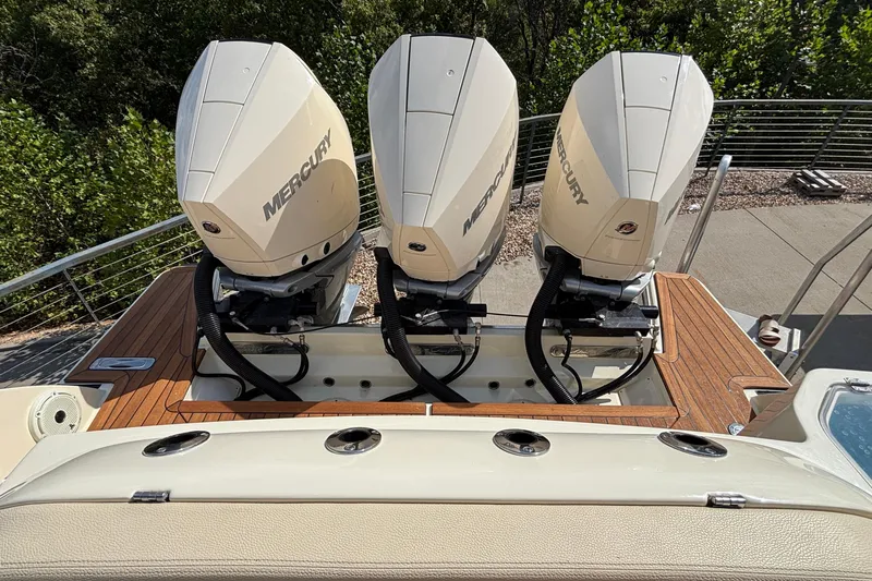  Yacht Photos Pics 2021 Chris-Craft Calypso 35 with triple Mercury outboard engines on teak deck.