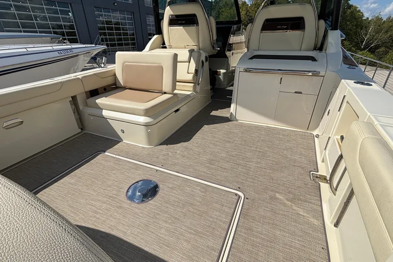  Yacht Photos Pics 2021 Chris-Craft Calypso 35 boat interior with beige seating and modern design.