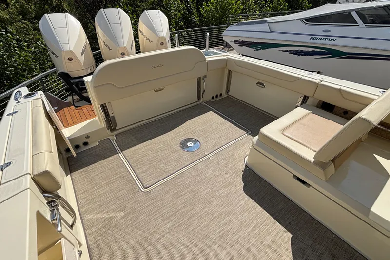  Yacht Photos Pics 2021 Chris-Craft Calypso 35 boat deck with Mercury engines, featuring spacious seating and elegant design.